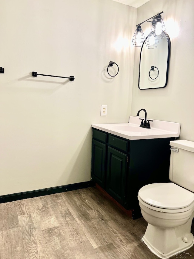 4865 Cactus Dr, Saginaw, MI 48603 - half bathroom with vanity and wood finished floors