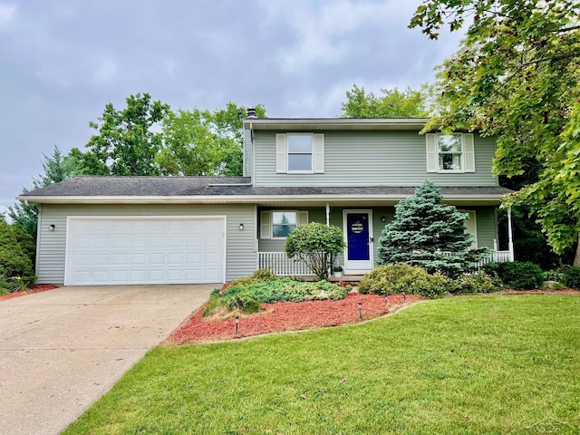 4865 Cactus Dr, Saginaw, MI 48603 - traditional-style home featuring a garage, concrete driveway, and a front yard