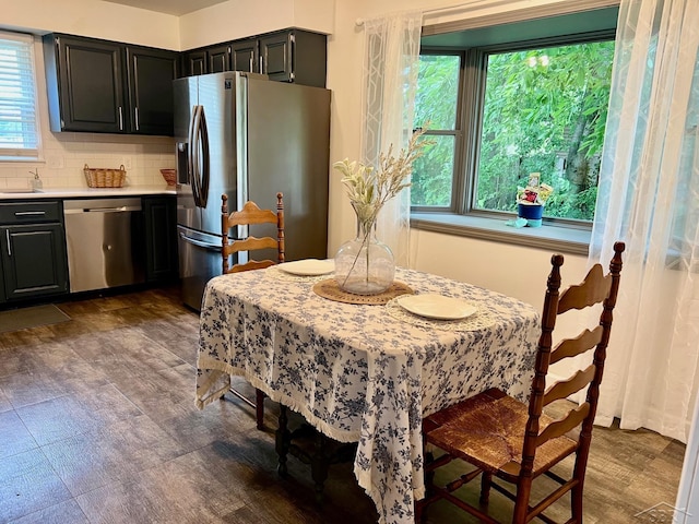 4865 Cactus Dr, Saginaw, MI 48603 - dining space with dark wood-style floors