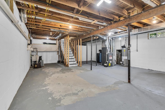 4825 Walz Rd, Jackson, MI 49201 - below grade area featuring water heater, heating unit, stairway, and concrete block wall