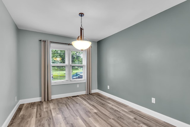 4825 Walz Rd, Jackson, MI 49201 - spare room featuring light wood-style floors and baseboards