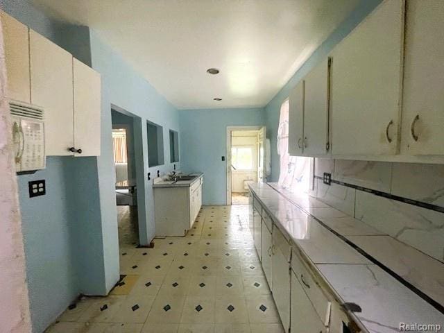 2471-2473 Lothrop St, Detroit, MI 48206 - kitchen with tile countertops and light floors