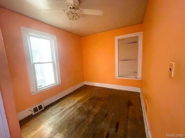 2471-2473 Lothrop St, Detroit, MI 48206 - empty room featuring dark wood-style flooring and ceiling fan