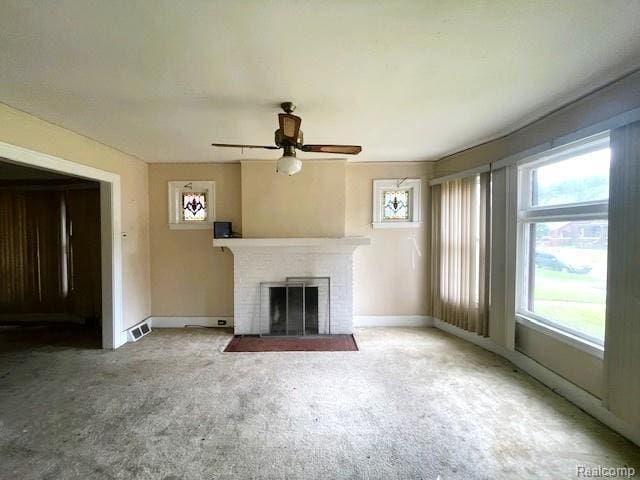 2471-2473 Lothrop St, Detroit, MI 48206 - unfurnished living room with a fireplace, a ceiling fan, and carpet floors