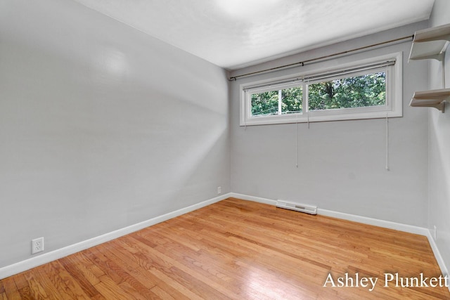 1460 N Peterson Rd, Muskegon, MI 49445 - unfurnished room with baseboards and light wood-type flooring