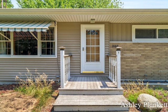 1460 N Peterson Rd, Muskegon, MI 49445 - property entrance with brick siding and board and batten siding