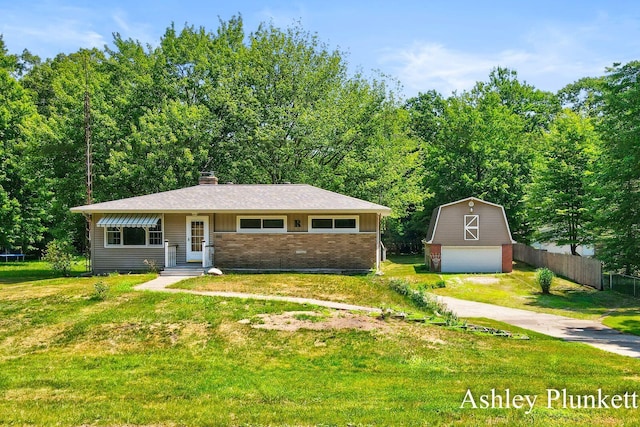 1460 N Peterson Rd, Muskegon, MI 49445 - view of front of home with a garage, brick siding, an outbuilding, a chimney, and a barn