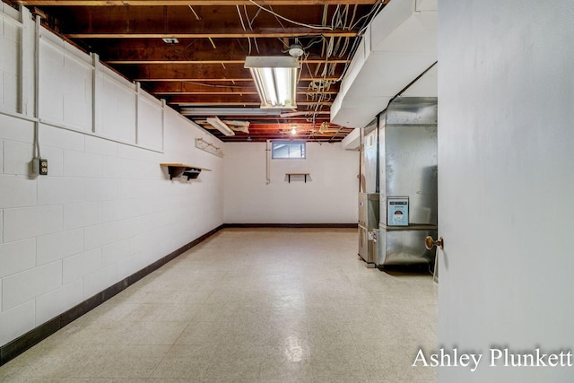 1460 N Peterson Rd, Muskegon, MI 49445 - below grade area featuring tile patterned floors and heating unit