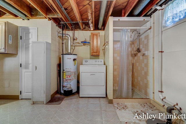 1460 N Peterson Rd, Muskegon, MI 49445 - below grade area with washer / clothes dryer, gas water heater, and light tile patterned floors