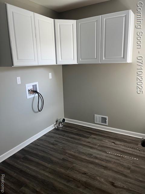 9351 Rayna Dr, Davison, MI 48423 - laundry room featuring cabinet space, hookup for a washing machine, dark wood-style flooring, and hookup for a gas dryer