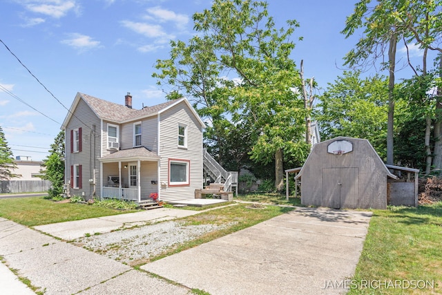 1002 Madison St, Grand Haven, MI 49417 - view of front of property featuring a storage shed, roof with shingles, a chimney, a front lawn, and concrete driveway