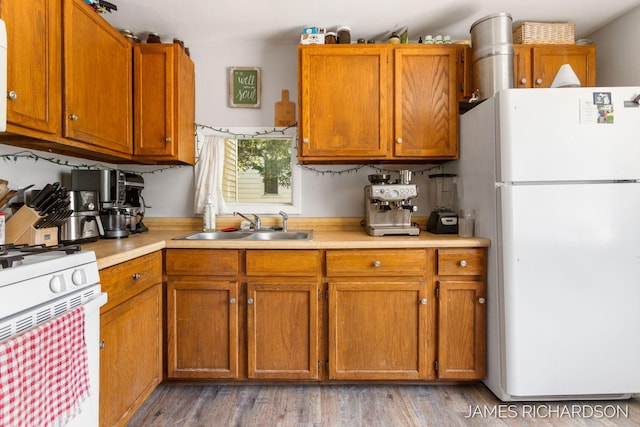 1002 Madison St, Grand Haven, MI 49417 - kitchen with white appliances, light countertops, and brown cabinets