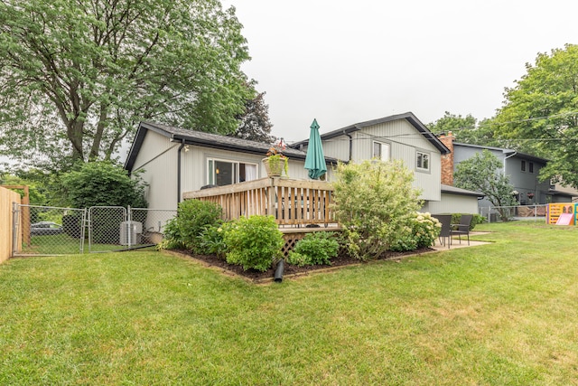 4893 Club Pl, Ypsilanti, MI 48197 - back of property with a gate, a wooden deck, and a chimney