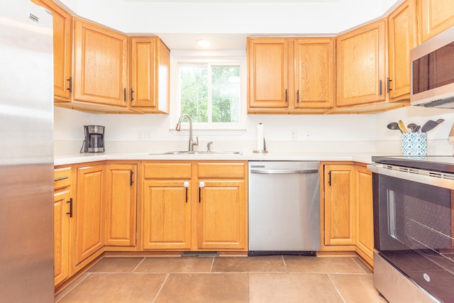 4893 Club Pl, Ypsilanti, MI 48197 - kitchen featuring stainless steel appliances, light countertops, and light tile patterned floors