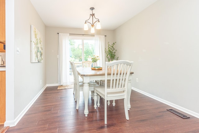 4893 Club Pl, Ypsilanti, MI 48197 - dining area with dark wood-style flooring and a chandelier