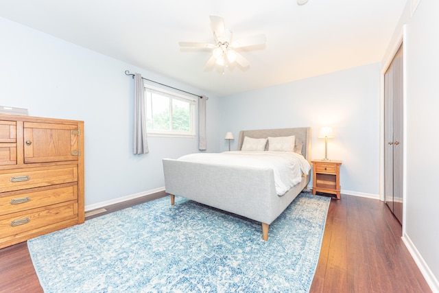4893 Club Pl, Ypsilanti, MI 48197 - bedroom with dark wood-type flooring, ceiling fan, and a closet