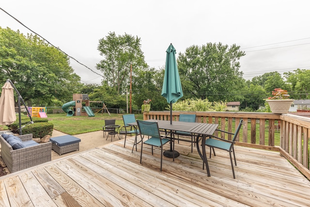 4893 Club Pl, Ypsilanti, MI 48197 - wooden terrace with outdoor dining space, a playground, and view of wooded area