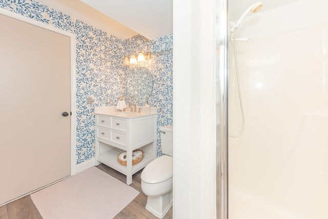 4893 Club Pl, Ypsilanti, MI 48197 - bathroom with wallpapered walls, wood finished floors, vanity, and a shower
