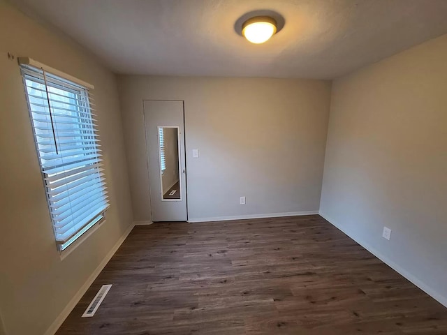 101 E Mckay St, Saline, MI 48176 - spare room with dark wood-style flooring