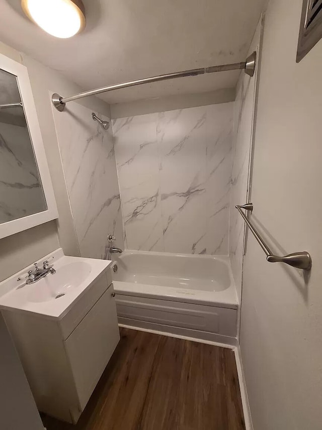 101 E Mckay St, Saline, MI 48176 - bathroom with tub / shower combination, vanity, and wood finished floors
