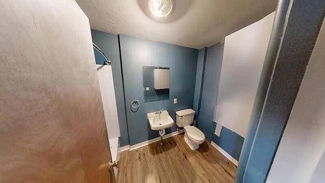 101 E Mckay St, Saline, MI 48176 - bathroom with toilet and wood finished floors