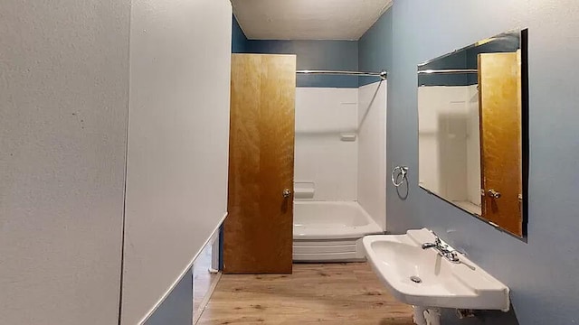 101 E Mckay St, Saline, MI 48176 - bathroom with wood finished floors and shower / bath combination
