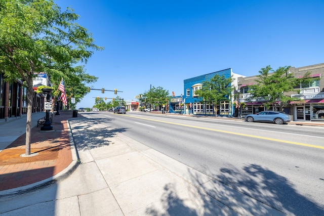 101 E Mckay St, Saline, MI 48176 - view of asphalt road with sidewalks, curbs, and traffic lights