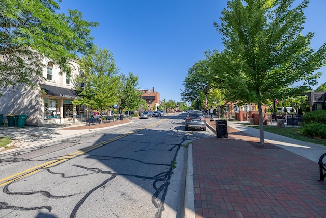 101 E Mckay St, Saline, MI 48176 - view of asphalt street featuring sidewalks, curbs, and street lighting