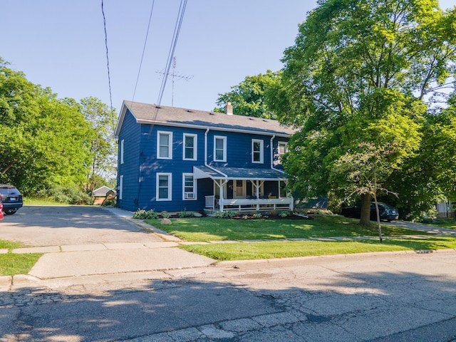 101 E Mckay St, Saline, MI 48176 - view of front of house with covered porch, a chimney, and a front yard