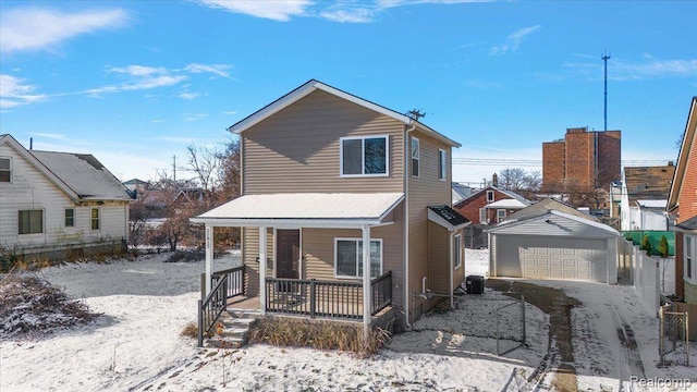 20817 Parkside Blvd, Ferndale, MI 48220 - view of front of property with a porch, a detached garage, and an outdoor structure