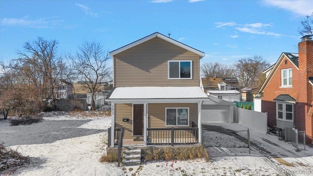 20817 Parkside Blvd, Ferndale, MI 48220 - view of front of home with a porch, a detached garage, and an outdoor structure
