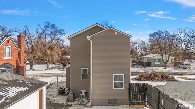 20817 Parkside Blvd, Ferndale, MI 48220 - view of snowy exterior with a central air condition unit