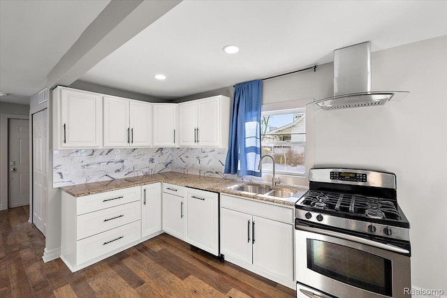 20817 Parkside Blvd, Ferndale, MI 48220 - kitchen featuring gas stove, wall chimney exhaust hood, decorative backsplash, light stone counters, and dark wood finished floors