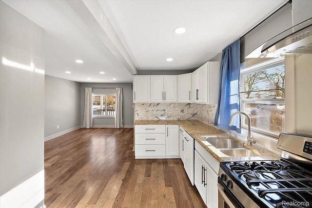 20817 Parkside Blvd, Ferndale, MI 48220 - kitchen featuring stainless steel gas range oven, light stone countertops, recessed lighting, dark wood finished floors, and white cabinets
