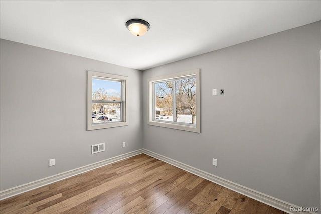 20817 Parkside Blvd, Ferndale, MI 48220 - empty room with wood-type flooring and baseboards