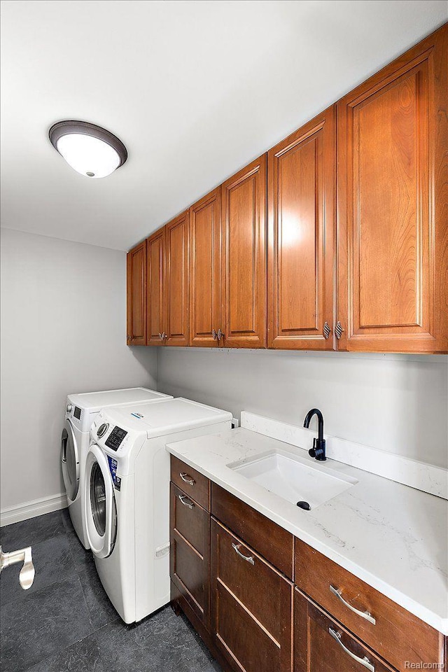 20817 Parkside Blvd, Ferndale, MI 48220 - washroom with cabinet space, independent washer and dryer, and dark tile patterned flooring