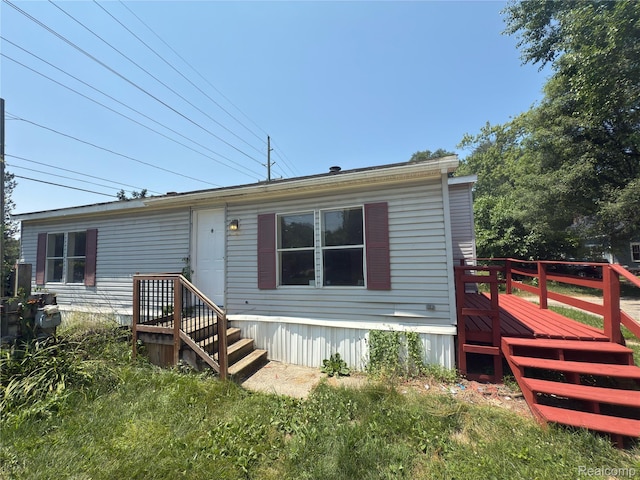 2445 E Grand River Ave, Lot, Williamston, MI 48895 - view of front facade featuring a deck