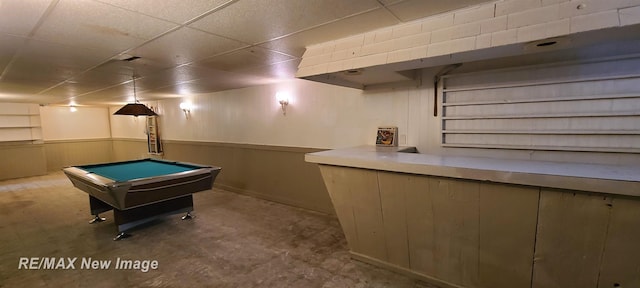 4404 Eastport Dr, Bridgeport, MI 48722 - game room with billiards table, concrete floors, a paneled ceiling, and a wainscoted wall