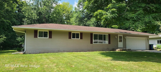 4404 Eastport Dr, Bridgeport, MI 48722 - view of front of house featuring an attached garage, a front lawn, and concrete driveway