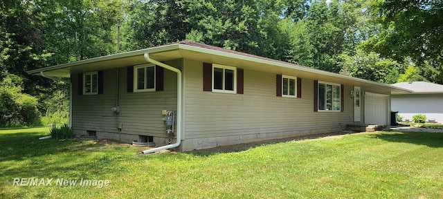 4404 Eastport Dr, Bridgeport, MI 48722 - view of front of property with an attached garage, a front yard, and view of scattered trees