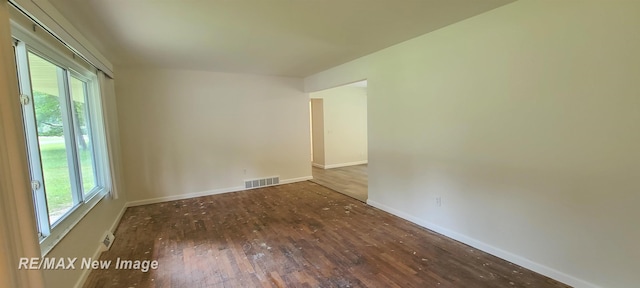 4404 Eastport Dr, Bridgeport, MI 48722 - spare room featuring wood finished floors and healthy amount of natural light