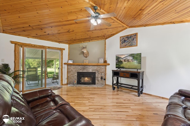 416 State Park Rd, Ortonville, MI 48462 - living area featuring wood ceiling, lofted ceiling, wood finished floors, a ceiling fan, and a fireplace