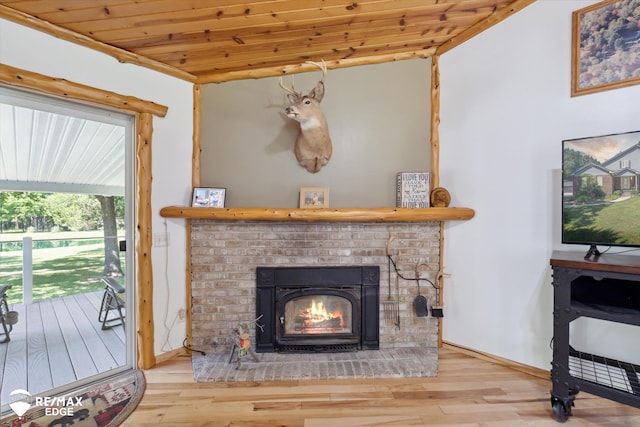 416 State Park Rd, Ortonville, MI 48462 - living area featuring wood finished floors, wooden ceiling, and a fireplace