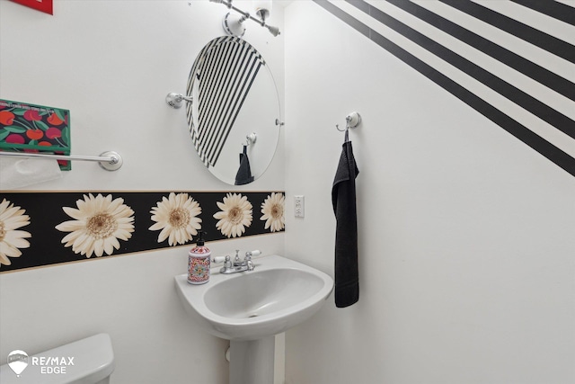 416 State Park Rd, Ortonville, MI 48462 - bathroom featuring toilet and a sink