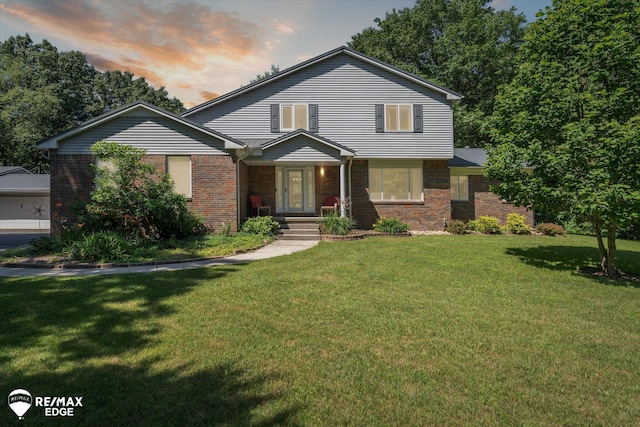 416 State Park Rd, Ortonville, MI 48462 - view of front of house with brick siding and a front yard