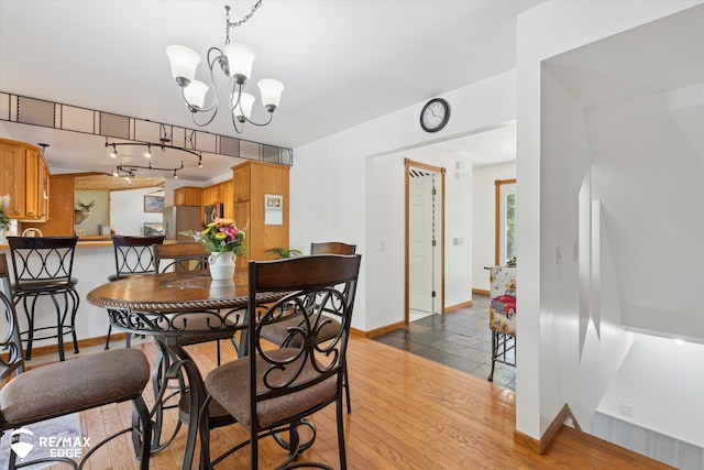 416 State Park Rd, Ortonville, MI 48462 - dining room with a chandelier and wood finished floors