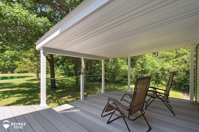 416 State Park Rd, Ortonville, MI 48462 - wooden terrace featuring a lawn and view of wooded area