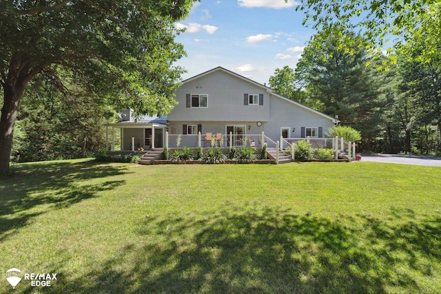 416 State Park Rd, Ortonville, MI 48462 - back of property featuring a wooden deck and a yard