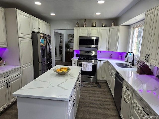 17328 Mcnamara Dr, Garden City, MI 48152 - kitchen featuring stainless steel appliances, a kitchen island, recessed lighting, light stone countertops, and white cabinets
