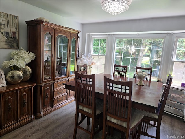 17328 Mcnamara Dr, Garden City, MI 48152 - dining room featuring wood finished floors, a chandelier, and plenty of natural light
